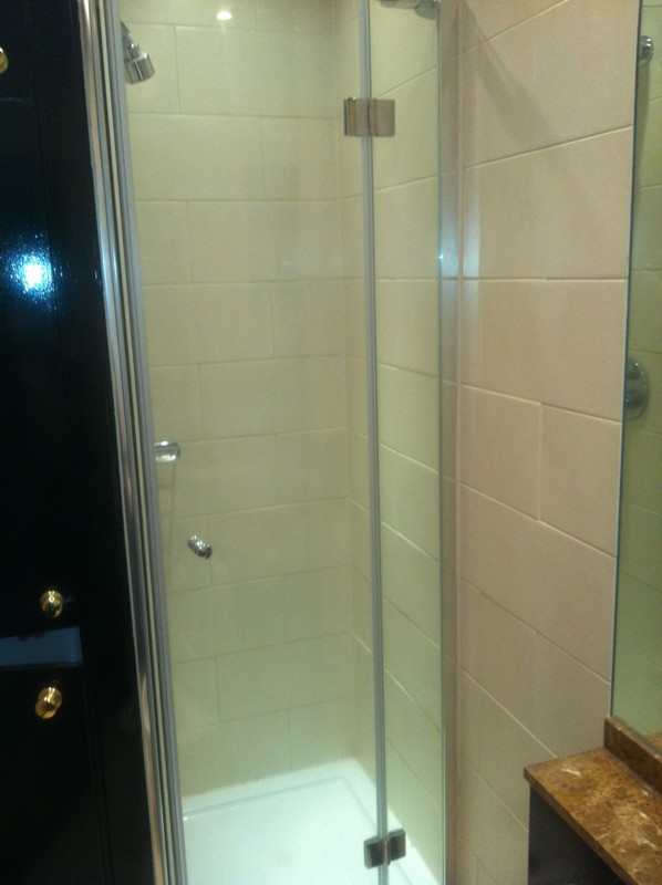 Frameless glass shower enclosure with chrome fittings in Maidenhead